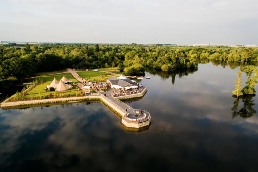 Aerial view of Amber Lakes in Berkshire – a Scandinavian-style lodge on a private lake, hired as an exclusive event venue