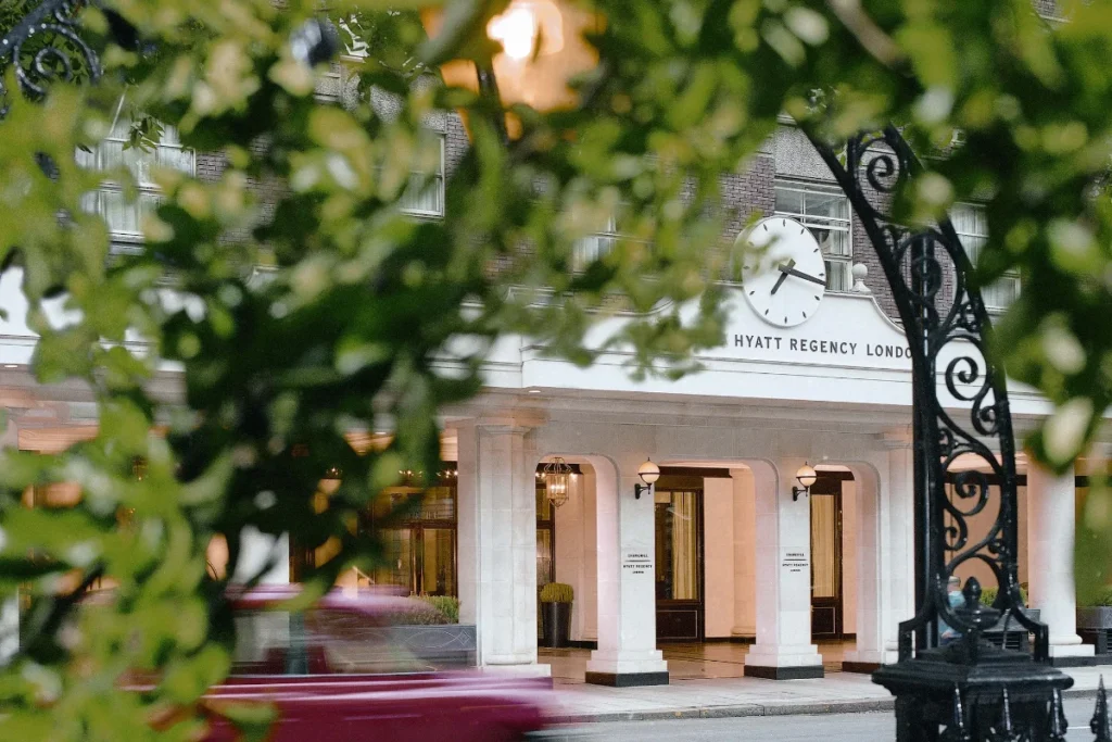 The colonnaded entrance of Hyatt Regency London – The Churchill on Portman Square, Marylebone, at dusk